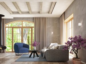 Miniaturka 3 - Jasny salon z sofą, kwiatami i białym kinkietem na ścianie