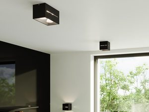 Miniaturka 10 - Czarne oświetlenie LED w salonie z betonową ścianą i zasłonami