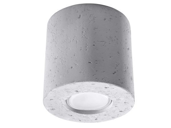 Betonowa lampa cylindryczna z subtelnym światłem punktowym