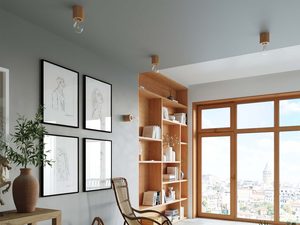 Miniaturka 4 - Widok salonu z naturalnym oświetleniem i kinkietami z drewna