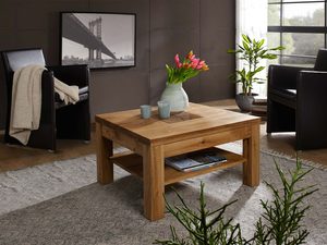 Miniaturka 1 - Stolik kawowy dębowy w aranżacji salonu z kwiatami i fotelami