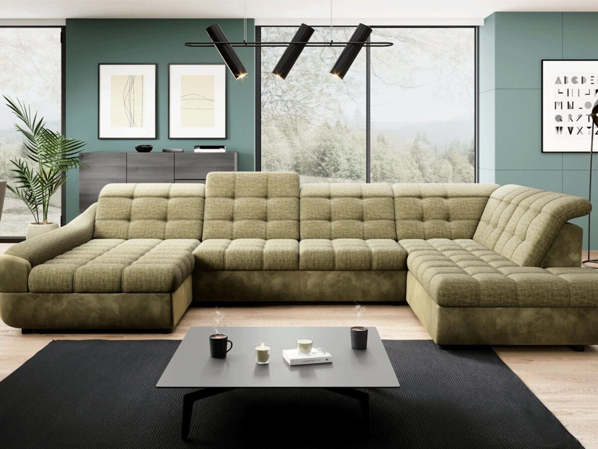 Zielony narożnik z szezlongiem w industrialnym wnętrzu z cegłą