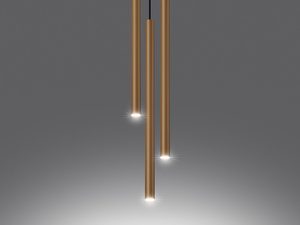 Miniaturka 3 - Złote tuby LED z czarnymi przewodami na tle szarej ściany