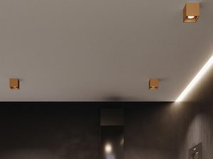 Miniaturka 5 - Salon z ciemną ścianą i złotymi lampami LED typu kostka