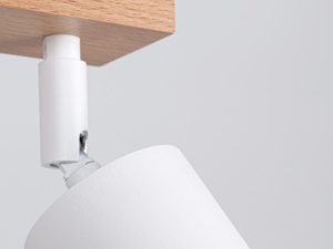 Miniaturka 3 - Zbliżenie na biały reflektor z możliwością regulacji kierunku światła