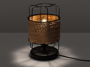 Miniaturka 2 - Wiklinowa lampa stołowa z włączonym światłem w ciemnym wnętrzu