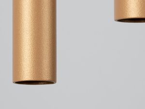 Miniaturka 18 - Zbliżenie na złoty cylindryczny klosz lampy tubowej