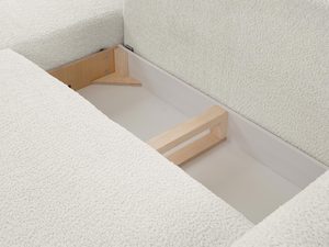 Miniaturka 9 - Detal tapicerki kremowego narożnika, miękka tkanina boucle