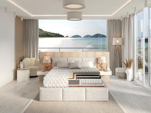 Miniaturka 1 - Białe łóżko kontynentalne z dekoracyjną narzutą w eleganckiej sypialni