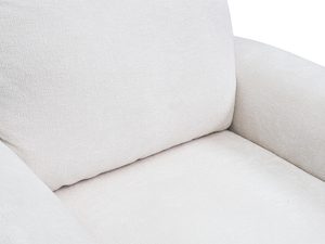 Miniaturka 6 - Beżowy fotel tapicerowany z szerokimi podłokietnikami i zaokrąglonymi krawędziami