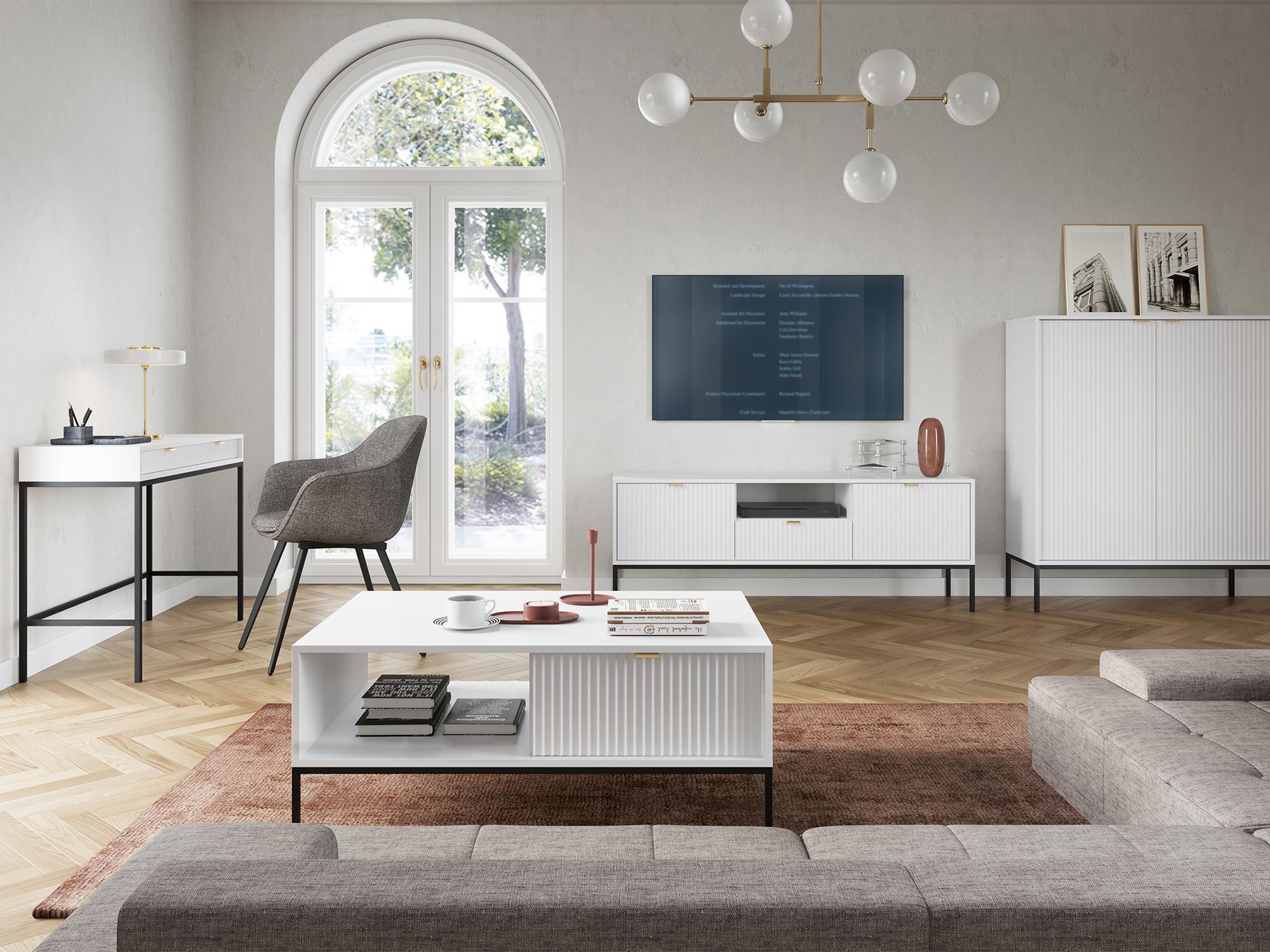 Aranżacja salonu z białą szafką RTV i frezowanym frontem