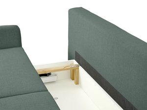 Miniaturka 24 - Detal zielonej tapicerki sofy z prostymi przeszyciami