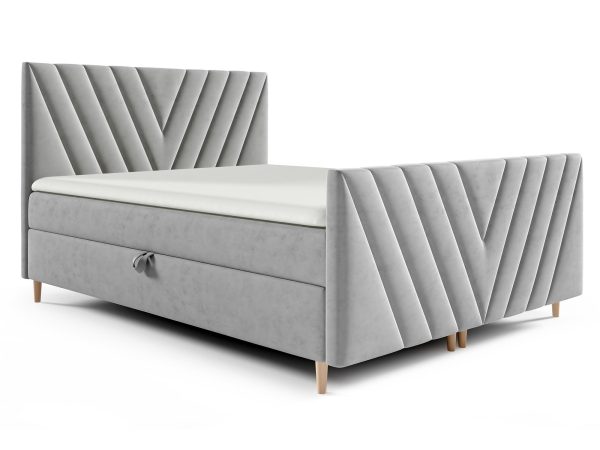 Łóżko tapicerowane w szarym kolorze z geometrycznym wzorem na zagłówku