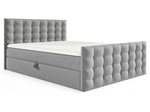 Łóżko tapicerowane w jasno szarym kolorze z pikowanym zagłówkiem