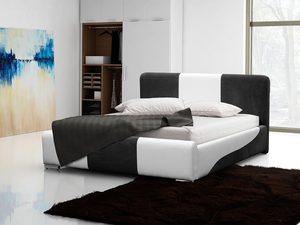 Miniaturka 2 - Nowoczesne biało-czarne łóżko z poduszkami i kocem, w jasnej sypialni z wykładziną.