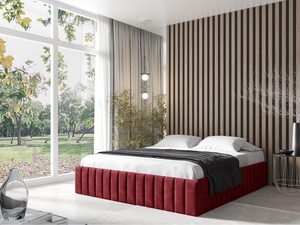 Miniaturka 11 - Czerwone łóżko z tekstylnym bokiem i wysokim wezgłowiem, naturalne światło dzienne.
