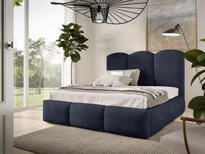 Miniaturka 6 - Granatowe łóżko z tapicerowanym wezgłowiem typu pufa, widok z boku.