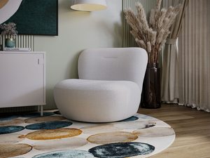 Miniaturka 44 - Biały fotel nowoczesny z miękką tapicerką w jasnym salonie