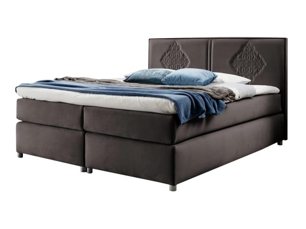 Brązowe łóżko kontynentalne w eleganckim wzornictwem