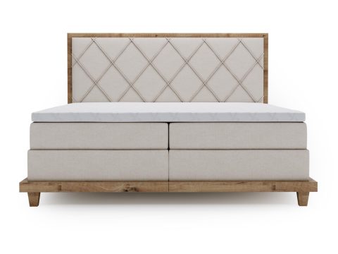 Beżowe łóżko tapicerowane z dużą powierzchnią spania