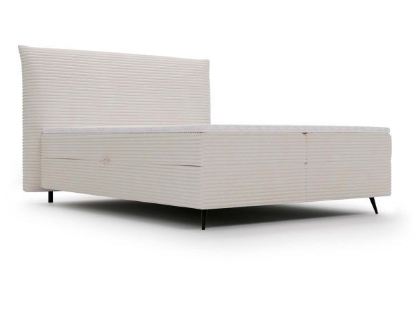 Białe łóżko tapicerowane z pojemnikiem i miękkim zagłówkiem w nowoczesnej sypialni