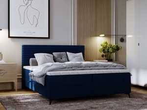 Miniaturka 30 - Granatowe łóżko tapicerowane z prążkowanym oparciem w sypialni