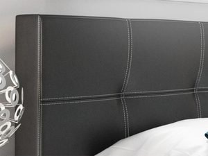 Miniaturka 4 - Zbliżenie czarnego zagłówka z dekoracyjnym przeszyciem w kształcie prostokątów.