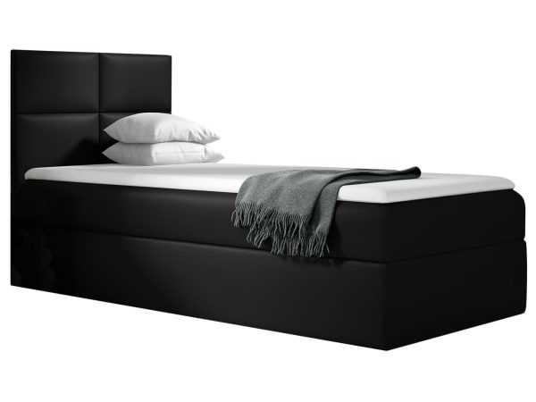 Czarne łóżko z niskim zagłówkiem – nowoczesny, surowy styl.