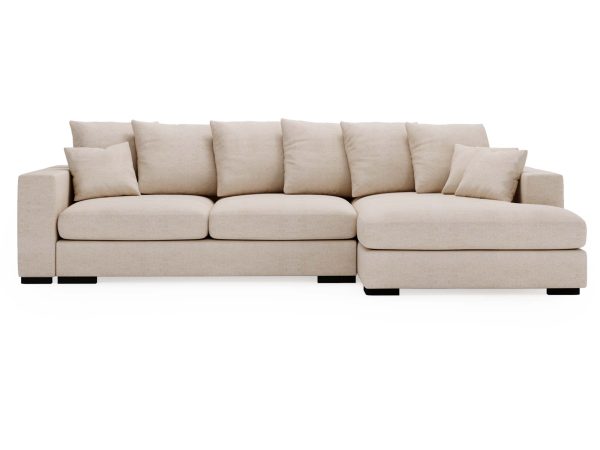 Sofa kremowa z szerokimi poduchami i czarnymi nogami