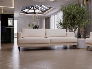 Miniaturka 32 - Sofa jasnobeżowa tapicerowana w przestronnym nowoczesnym salonie