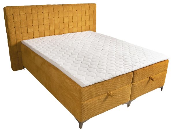Biały materac z sześciokątnym wzorem i musztardowym zagłówkiem