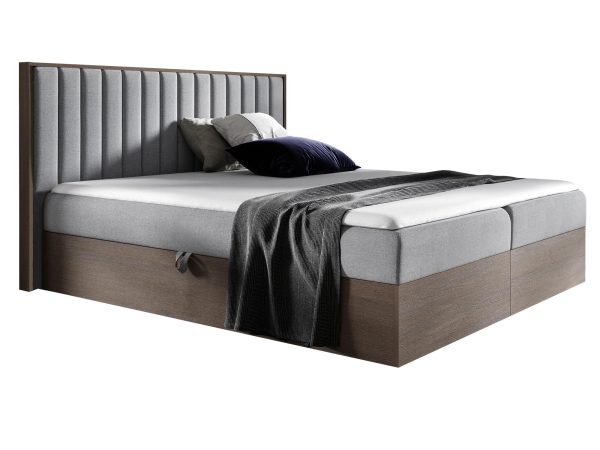 Tapicerowane łóżko w kolorze szarym z delikatnym przeszyciem