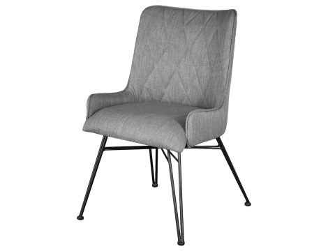 Szare tapicerowane krzesło z metalowymi nogami w aranżacji jadalni styl industrialny