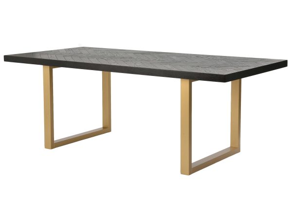 Minimalistyczny stół do jadalni z ciemnego drewna i złotymi nogami