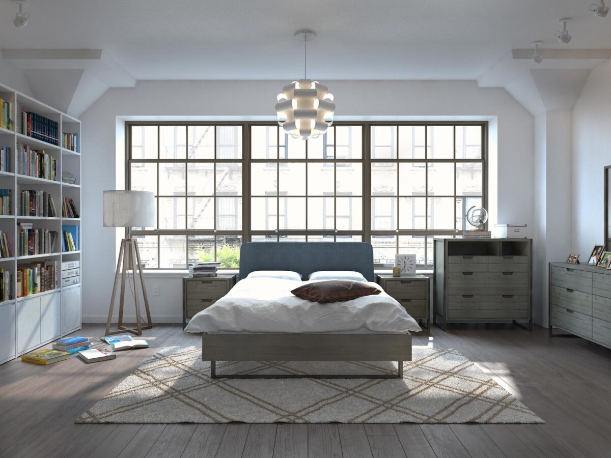 Drewniane łóżko z wysokim zagłówkiem w jasnej sypialni nowoczesnej