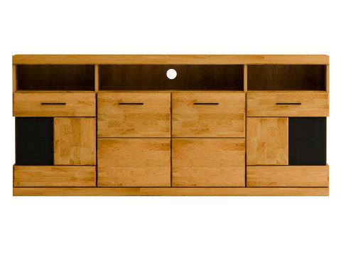 Niska szafka RTV z czarnymi frontami i półkami, tło z cegły