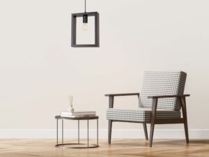 Miniaturka 11 - Czarna lampa wisząca kwadratowa w aranżacji salonu z fotelem