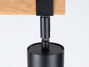 Miniaturka 8 - Detal przegubu obrotowego czarnego reflektora na drewnianej listwie