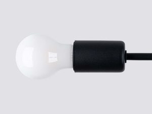 Miniaturka 3 - Detal czarnej oprawki metalowej z białą żarówką