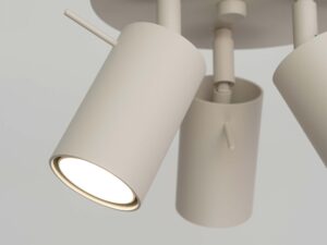 Miniaturka 4 - Detal białego cylindrycznego reflektora plafonu świecącego ciepłym światłem