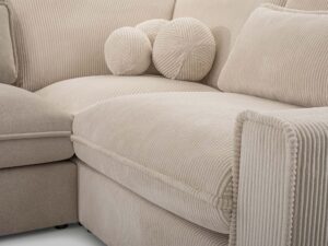 Miniaturka 8 - Detal tapicerki sztruksowej kremowej narożnika z okrągłymi poduszkami