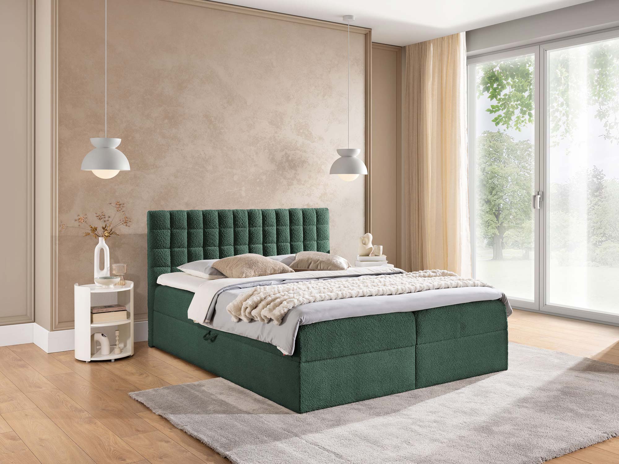 Zielone łóżko tapicerowane z pikowanym zagłówkiem w boucle