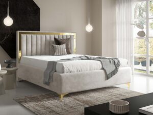 Miniaturka 70 - Kremowe łóżko tapicerowane ze złotą ramką w eleganckiej sypialni