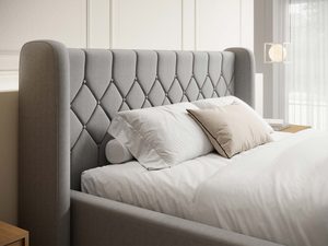 Miniaturka 4 - Łóżko szare detal pikowanego zagłówka uszatek w aranżacji zbliżenie