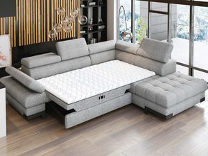 Miniaturka 1 - Narożnik szary z funkcją spania rozłożony w aranżacji salonu