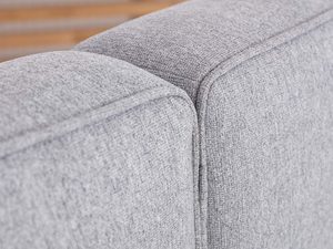 Miniaturka 5 - Detal tapicerowanego zagłówka szarego narożnik i tkanina zbliżenie