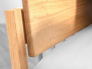 Miniaturka 7 - Detal zagłówka drewnianego łóżka dębowego połączenie z nogą usłojenie drewna
