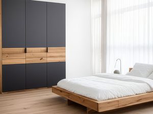Miniaturka 5 - Szafa grafitowa z dębowymi szufladami w białej sypialni z łóżkiem aranżacja