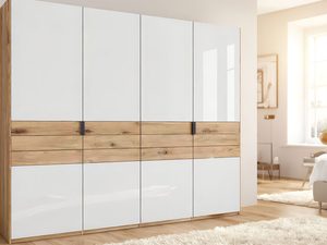 Miniaturka 4 - Biała szafa z dębowymi szufladami w słonecznej sypialni z dywanem aranżacja