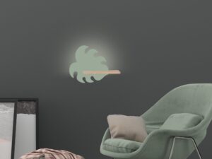 Miniaturka 3 - Kinkiet LED w kształcie zielonego liścia nad fotelem w aranżacji pokoju